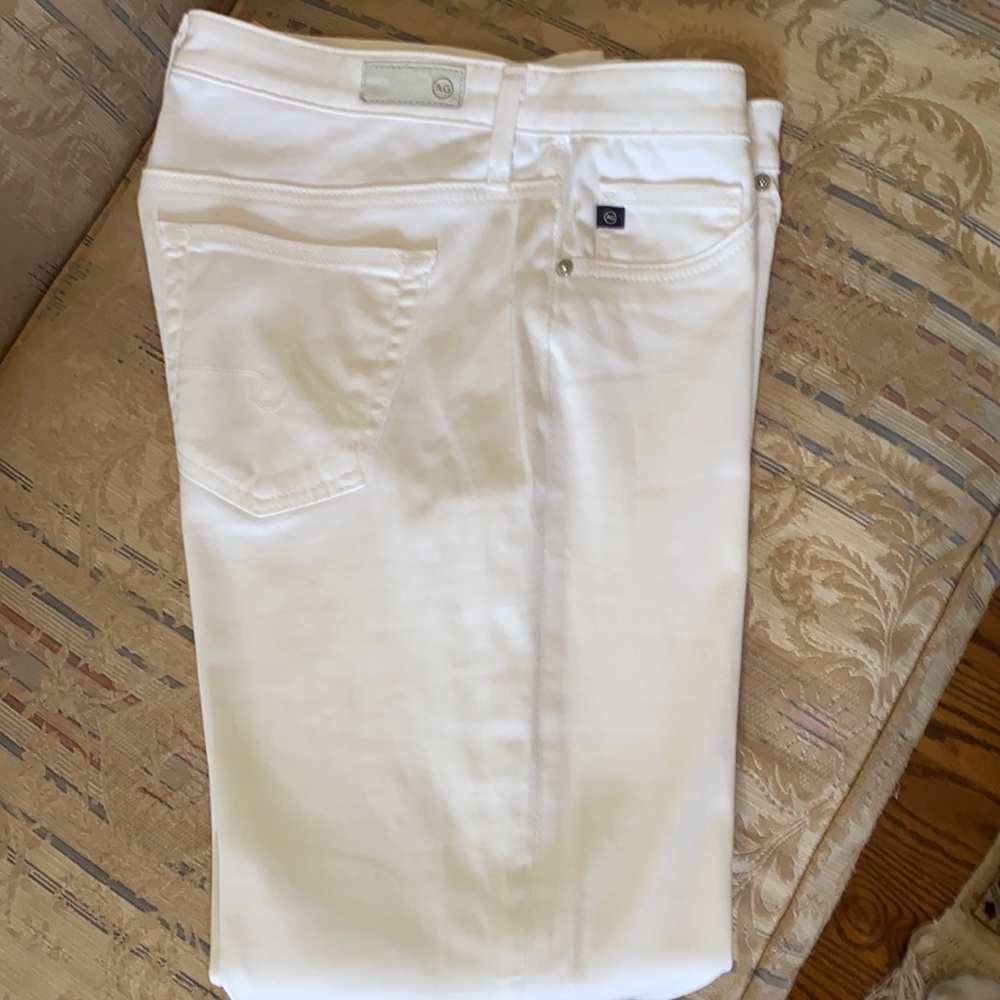 AG The Stilt Cigarette Leg white pants.